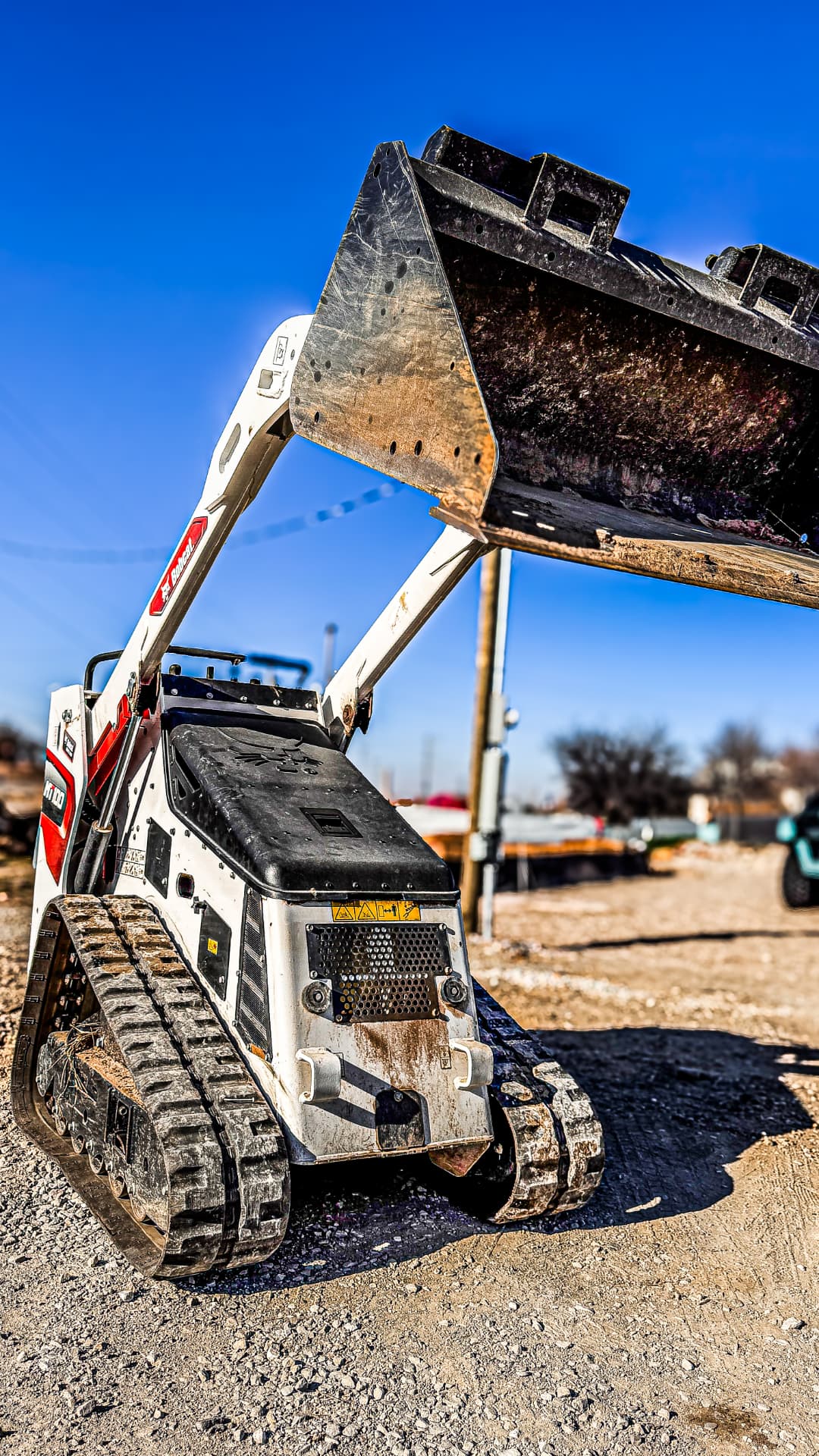 Bobcat MT100 mini skid loader with its bucket raised